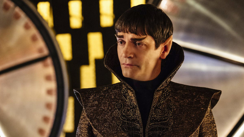 Also, during this talk, the Sarek hologram...has a seat on the desk? How? Did he sit down wherever he was and the hologram somehow....know and put him on the desk?